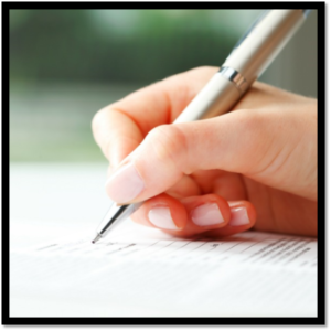 Hand with pen filling out application